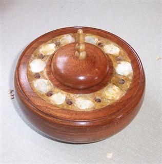 Lidded mahogany bowl with a sea shell inlay by John Brocklehurst